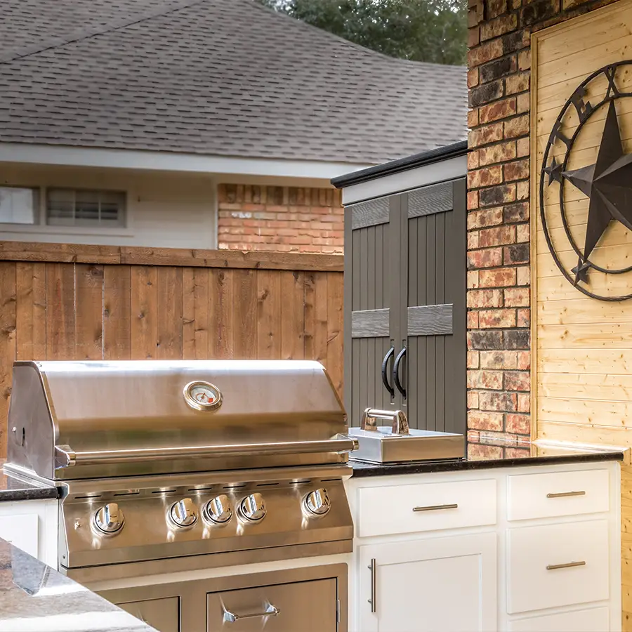 Outdoor grill and cabinets on patio